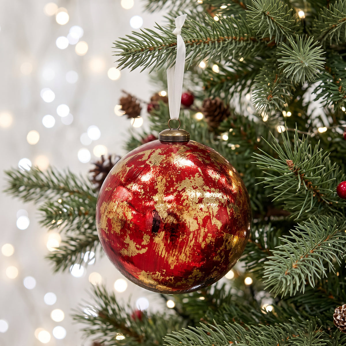 Abstract Red Paint Bauble 15cm displayed on festive Christmas tree