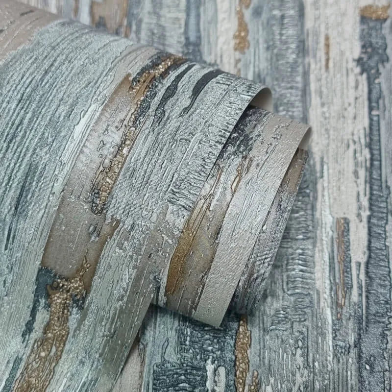 Gianni Plain Blue & Grey Textured Wallpaper close up showing distressed blue grey and metallic textured finish
