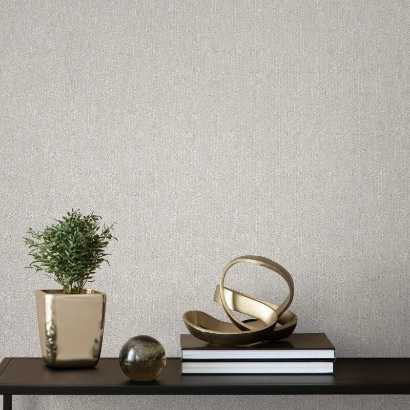Gianni Plain Grey Textured Wallpaper styled with gold accessories in modern neutral interior