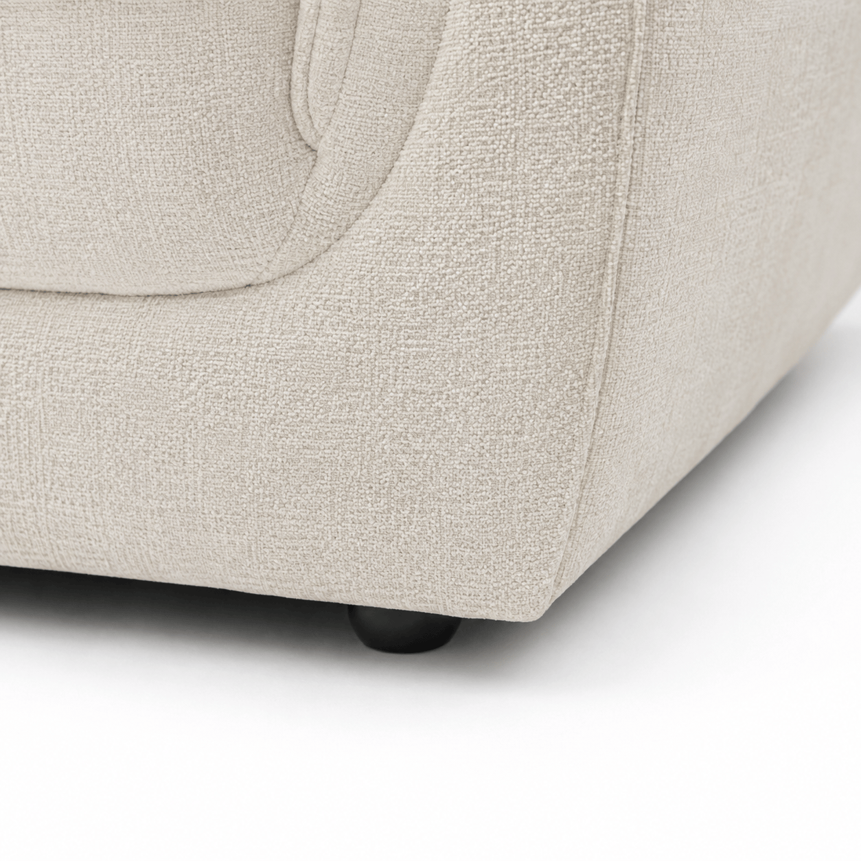 Margot LHF Chaise Sofa - White close up of black sofa foot and fabric texture