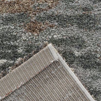 Mehari Green Cloud Rug close-up showing textured green grey cream and brown rug design