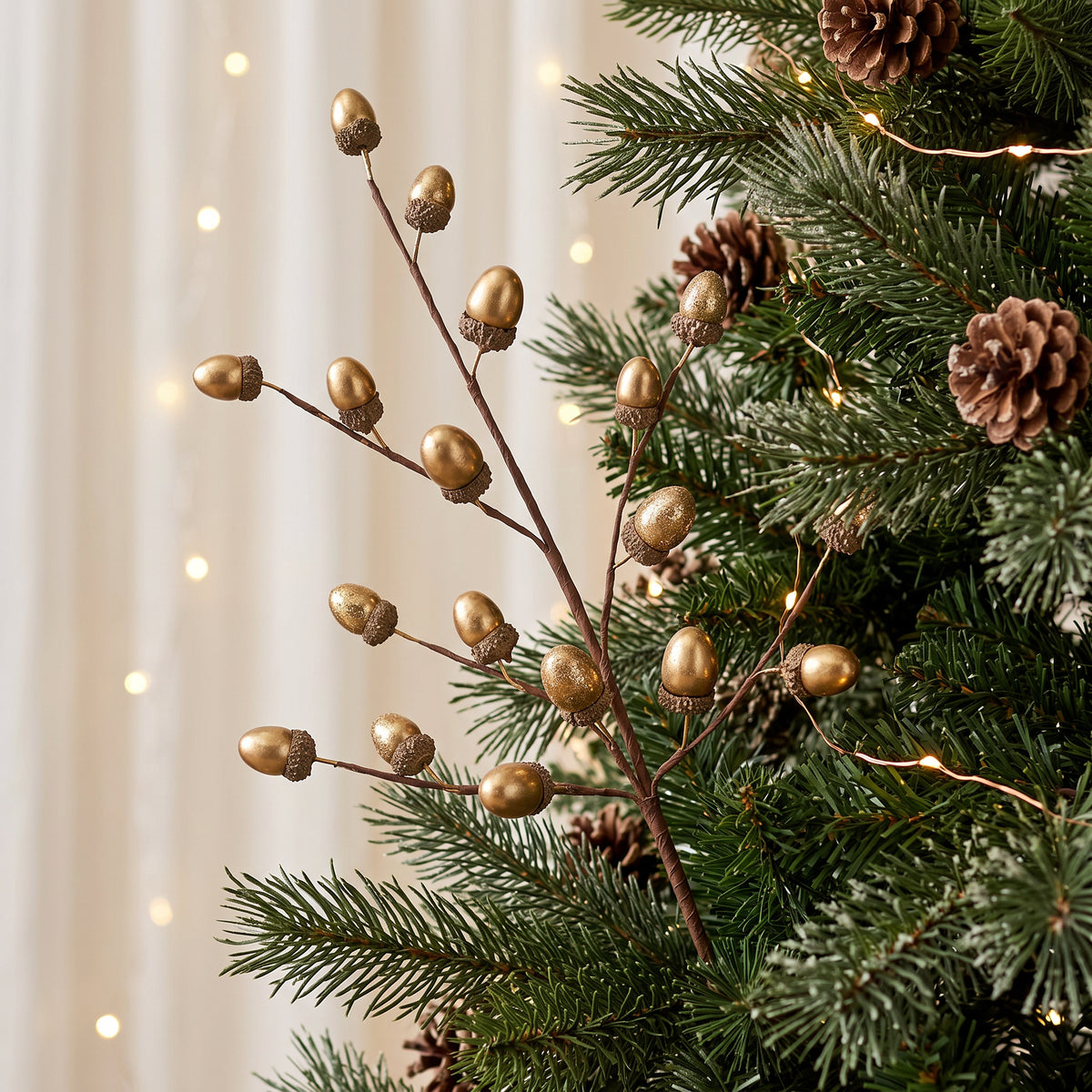 Metallic Gold Acorn Spray 61cm styled in Christmas tree with festive decorations