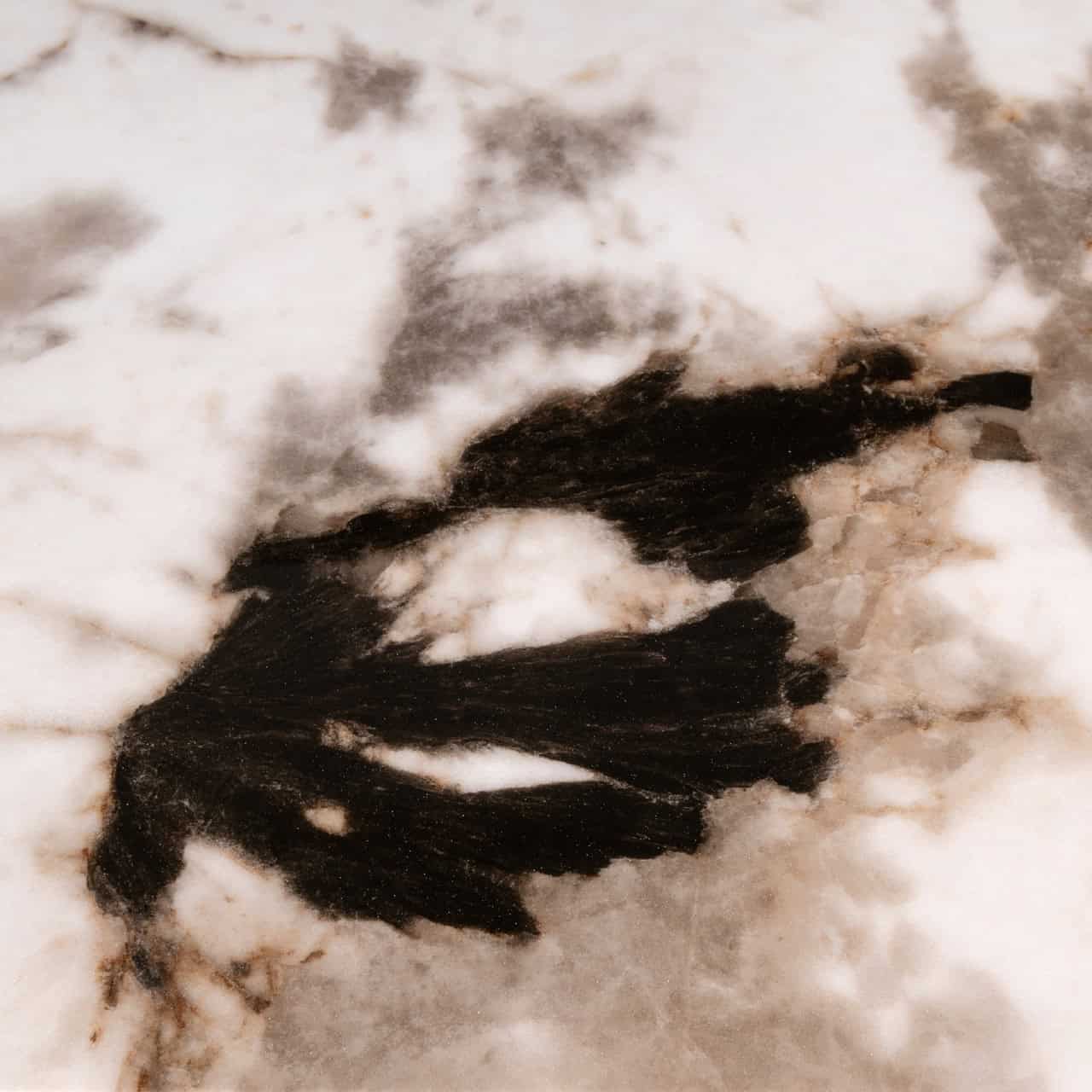 Richmond Langford Dining Table veined marble effect surface close up