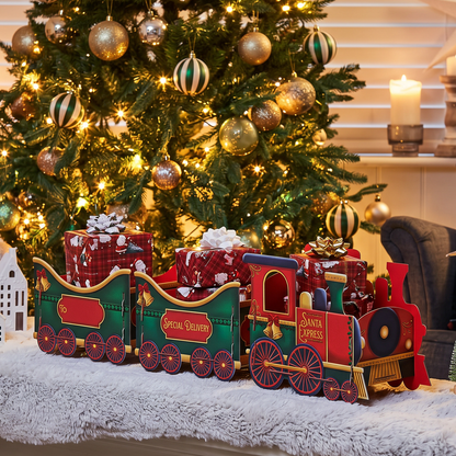 Small Santa Christmas Train Gift Box Red displayed beside decorated Christmas tree