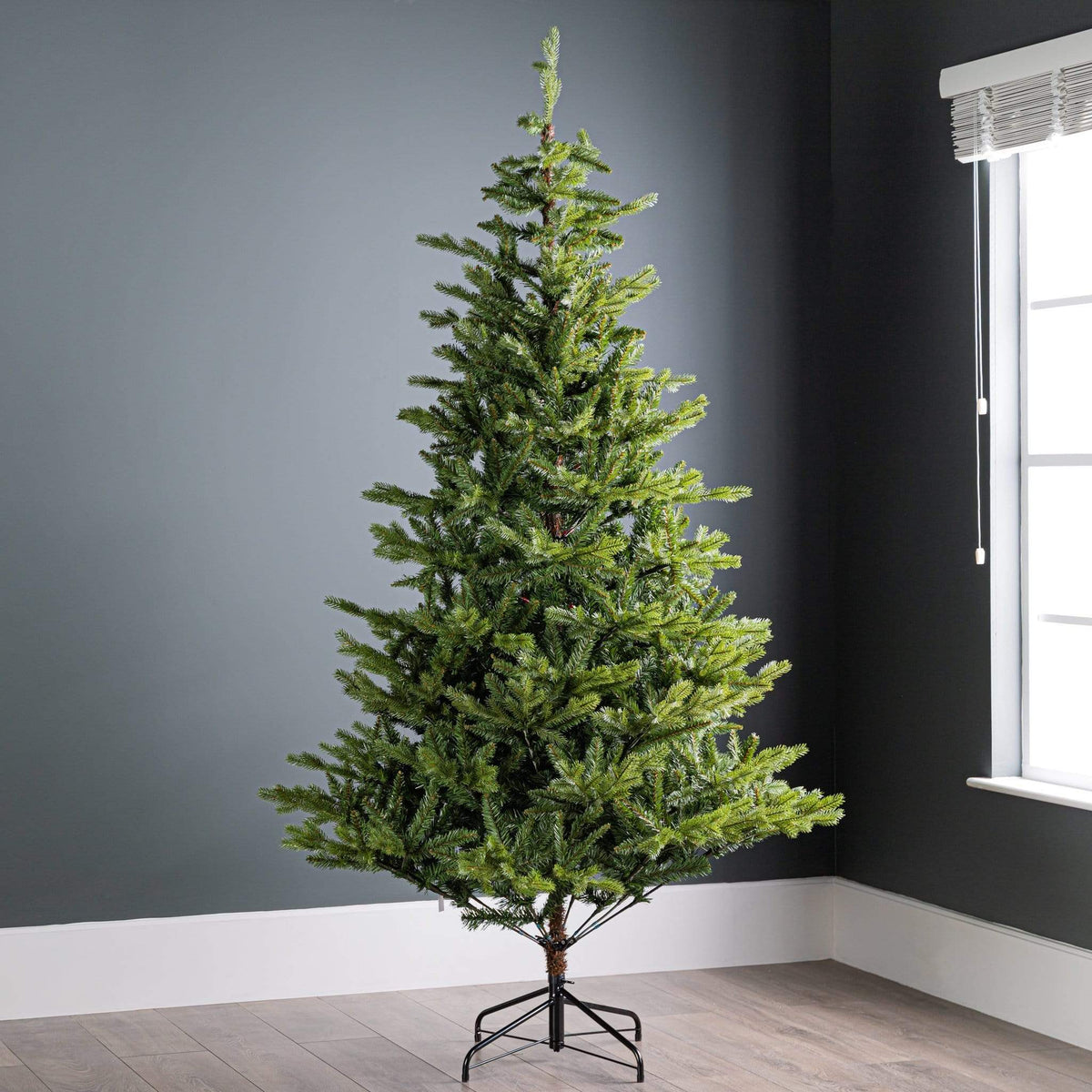 Everlands Allison Pine Christmas Tree 7ft artificial green pine tree with realistic open branches and metal stand.