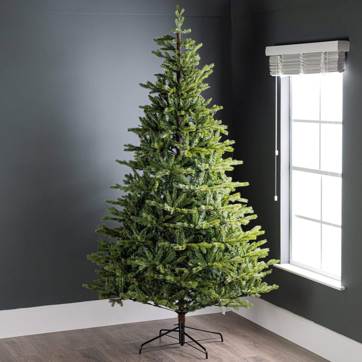Everlands Allison Pine Christmas Tree 8ft artificial green pine tree with black metal stand.